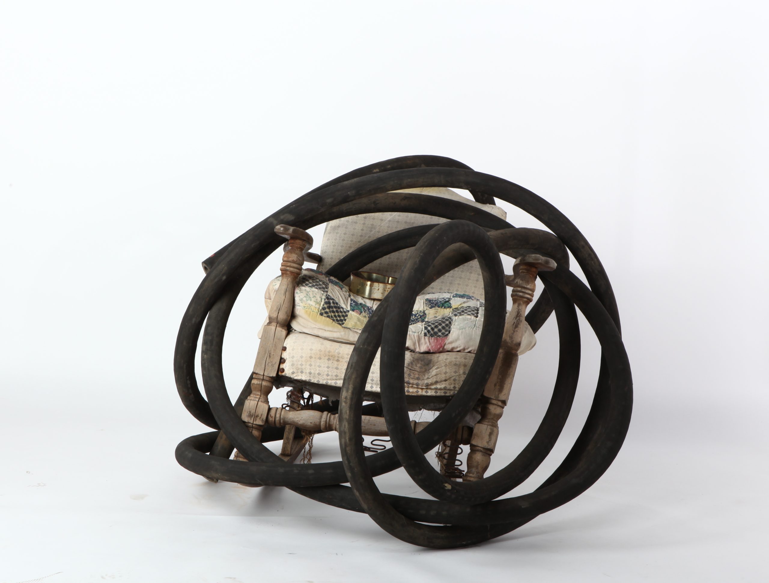 Lonnie Holley, WEIGHED DOWN BY THE HOSE, 2008
Found rocking chair, old quilt, heart-shaped box, rubber hose Image courtesy of the artist